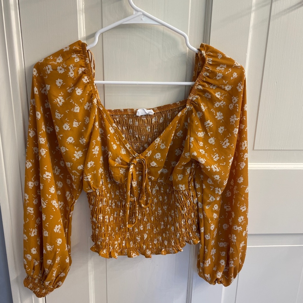 sienna sky long sleeve gold smocked top with white flowers